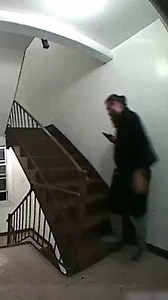 Moment nosy neighbour falls down stairs | The Sun News
