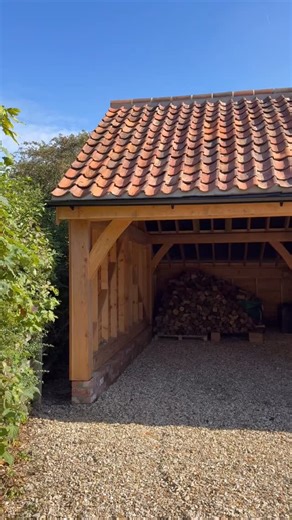 Designed and built in-house, this Douglas fir carport was crafted to feel like a natural extension of our client’s home. The catslide roof creates a sheltered storage area at the rear, perfect for hiding the oil tank and stacking winter logs, while the pantile roof ties seamlessly into the existing house. With mortise and tenon joints, larch cladding, and roof lights that draw daylight into the space, it’s a practical structure made with the same care and craftsmanship as any home interior. @j3r