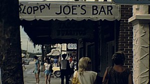 Key West, USA - 1983: people walk under Sloppy Joes Bar, United States of America