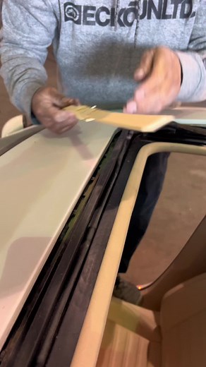 Applying Yellow Adhesive Film to Car Windows