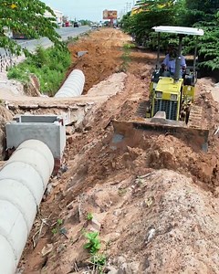 2.5K views · 42 reactions | Mini Dozer in Action! Burying Drain & Sewage Water _ Clearing Trash at Twin Street House Entrance! | Yolo aventuras TV | Facebook