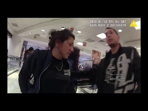 Caught in the act: Footage shows fired SAPD officer struggle with security over stolen items, gun