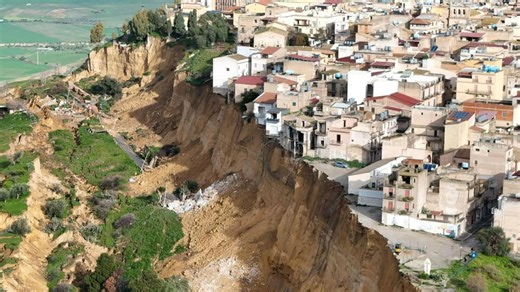 Terrifying vid shows houses on edge of cliff after 4km-long landslide