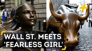 A statue of a fearless young girl is now staring down the Wall Street bull. Will she smash the glass ceiling? #InternationalWomensDay | AJ
