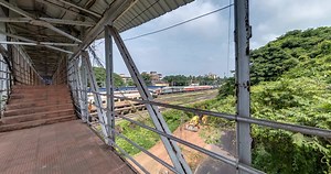 Download full loop 360 rotation inside iron steel frame construction of pedestrian crossing over railway for free
