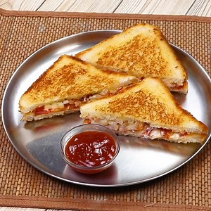 3.8M views · 34K reactions | Ingredients: Bread Slices - 4 Onion -2 Tomato - 2 Cheese slices - 4 Mixed herbs - 1/4 tsp Chilli flakes -1/2 tsp Chaat masala powder -1/4 tsp Salt to taste Butter - 2 tbsp | Kabita's Kitchen | Facebook