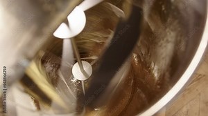 Centrifugal force of spinning extractor removes honey from uncapped frames