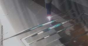 The process of cutting a metal part with a plasma cutter. Plasma cutting. Plasma cutter work at the factory. The plasma cutter will cut the part.