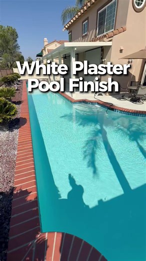 If you’ve been trying to visualize how a classic white plaster finish will look in your own backyard, this video gives you a real-world look at its tone, brightness, and how it changes throughout the day ☀️ Every pool reads a little differently depending on sunlight, depth, and surroundings, so seeing examples can make the decision easier. Thinking about white plaster for your build? We’re happy to help you compare all your finish options. | Majestic Pool Construction | Facebook