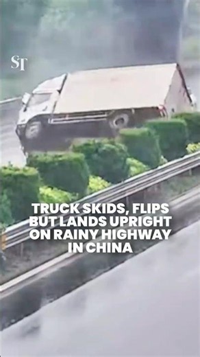 Truck miraculously lands upright after skidding, flipping on rainy highway in Zhejiang, China