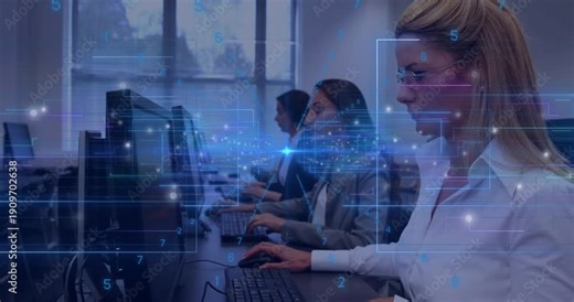 Three women typing in training, HUD overlay passing between screens and causing camera pan right
