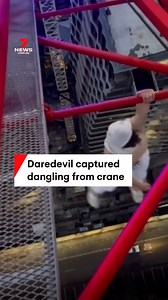 2M views · 5.2K reactions | A teenage boy has been captured dangling from a construction site crane on the Gold Coast. The self-proclaimed daredevil dangerously hangs from the crane with one arm whilst also performing pull ups. #dangerous #stunt #crane #daredevil #adrenaline #dangling #GoldCoast #7NEWS | 7NEWS Brisbane | Facebook