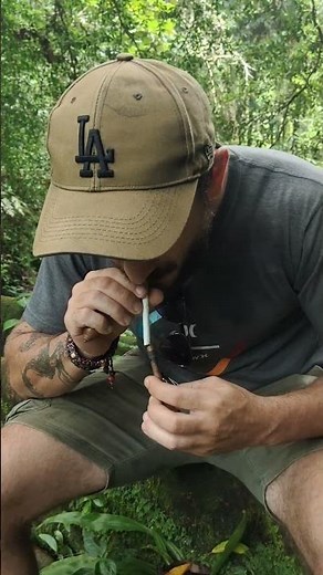 Lighting a cigarette using a homemade wooden fire piston