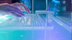 In the Futuristic Laboratory Scientist Works with Transparent Touchscreen Keyboard