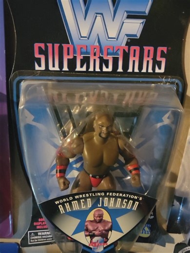 C and J Collectibles Presents: A look back at the beginning WWF Jakks Pacific Superstars Our wall Highlighting Series 1, 2 and 3. A little story to go with this one. As the boy us opening up Christmas Presents and playing with a ton of figures and accessories from Ringside Collectibles, he asks to watch some old wrestling. I pick an old Raw and Ahmed Johnson comes on. His reaction was the same as mine when I first saw Ahmed on tv.