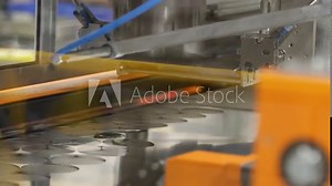 Automatic Machine Punching Aluminum Sheet For Cap At The Production Line - Cap Lining Machine - close up shot