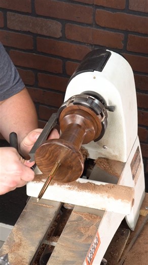ToolsToday on Instagram: "Coming in at number 4 for 2025 is the walnut + brass pushpin completed! ✨ After weeks of cutting, stacking, turning, sanding, and problem-solving, it all came down to this last step. I protected the walnut, polished the brass to a mirror shine, trimmed and sanded the edge, and finished it off smooth. What started years ago with a quirky walnut + brass clothespin I found at a garage sale has now turned into a giant pushpin that makes me smile every time I see it. This pr