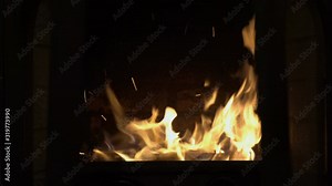 The glass doors of the burning fireplace automatically open without human intervention and close. View of the fire inside the fireplace. Symbol. Concept. Closeup. 4K.