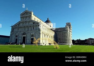 Pisa, Italy, December 27, 2025: The piazza dei miracoli in pisa, showcasing the iconic leaning tower, the cathedral, and the baptistery. scaffolding is present on the tower during restoration, under a clear blue sky and surrounded by a lush green Stock Video Footage - Alamy