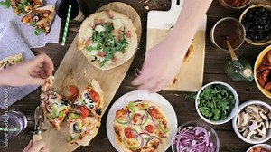 Time-lapse. Eating individual pizzas from pizza bar