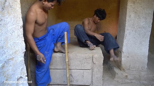 Watch these men build a modern two-story underground house deep in the jungle