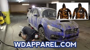 Blasting mud from the muddiest Subaru WRX ever