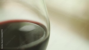 Spoon tapping on wine glass to call attention in event - close up