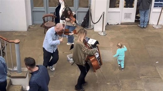 Little Boy Joins the Fun as Musicians Run in Circles at Covent Garden