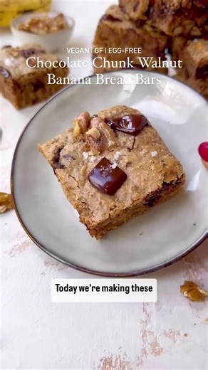 Chocolate Chunk Walnut Banana Bread Bars 🍫🍌 Thick, chewy and fudgy banana bread cake bars packed with melting chunks of chocolate and pieces of walnuts - who wants a bite? Chocolate Chunk Walnut Banana Bread Bars 🍫🍌 The ingredients are: ⭐︎ripe banana ⭐︎almond butter ⭐︎maple syrup ⭐︎chia or flaxseed ⭐︎oats or oat flour ⭐︎plain or GF or spelt flour ⭐︎cinnamon ⭐︎dark chocolate ⭐︎walnuts ⭐︎raising agents and salt . 🍫Get the full recipe on @nourishing.amy page 🍌 . #vegan | Vegan A Bit Of All