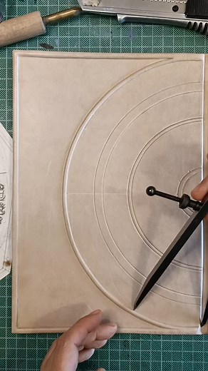 Currently on the workbench. Can you guess what the theme of this journal is? . . . #workinprogress #bookbinding #tooling #leatherjournal #artjournal | TeoStudio