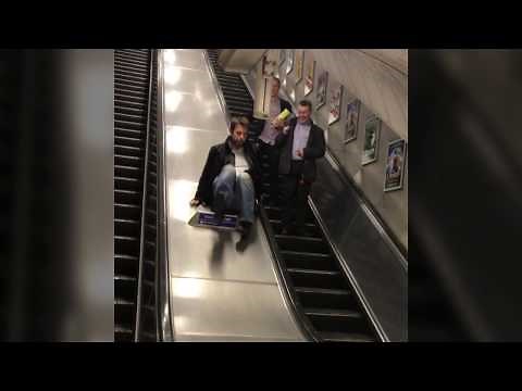 Guy Falling down the Escalator
