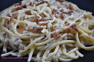 EASY FILIPINO STYLE CARBONARA INGREDIENTS: 200g Bacon 500g Spaghetti Pasta 3 cups All-purpose Cream 1.5 Evaporated Milk 1/2 cup Cheese 1 cup Mushrooms (finely chopped) 1 medium sized Onion (chopped) 3 cloves Garlic (minced) 50g Butter Water Salt Pepper Full recipe: https://www.delishph.com/easy-filipino-style-carbonara/ Special thanks to: Masflex: https://www.facebook.com/MasflexCookware/ Masflex Kitchenpro: https://www.facebook.com/ChefGeneKitchenPro/ Let's Connect: Instagram: https://www.insta