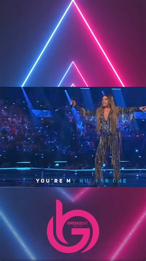 Helena Paparizou has the whole crowd singing along to her winning song “My Number One” We’re you singing along too 🤔🎶 19 years after captivating the world with her mesmerising win at the 2005 Eurovision Song Contest, @helenapaparizouofficial amazes adoring fans with another performance of her hit “My Number One” earlier this week at the second semi final of this years competition, wearing a beautiful ensemble designed and created by @vrettosvrettakos_ Keep watching to see how the dress was cre