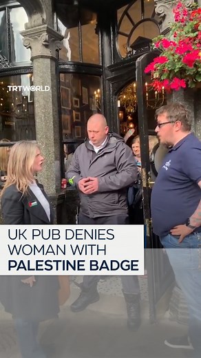 22K views · 1K reactions | "If I were wearing an American, English, or Ukrainian flag, you wouldn't ask me to remove it." A woman was outraged after being denied entry to a pub in London, UK, for wearing a Palestinian flag badge. | TRT World | Facebook