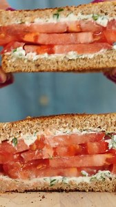 THIS IS THE ONLY TOMATO SANDWICH RECIPE YOU’LL EVER NEED! This classic tomato sandwich features a lovely combination of sweet juicy tomatoes and herby cream cheese. You can make a big batch of the cream cheese mixture and have it on hand to spread on bagels or crackers. For a boost of protein, add smoked salmon or sliced turkey or chicken. Click here for the full recipe: https://bit.ly/3psi63w | EatingWell