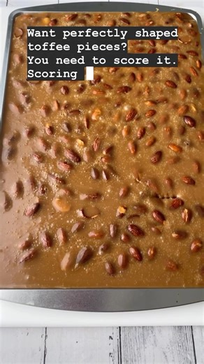 Smoked almond toffee with a scoring tip! Do you score your toffee or just break it apart? Honestly, both are delicious. Ps. This is technically butter crunch! What’s the difference between toffee, butter crunch, and brittles? I’ve got an article on my website that explains it! #toffee #sweets #holidaybaking #candyland #christmascrack #almondroca | One Sweet Mama