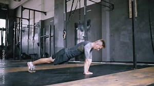 Athletic young man doing diamond push-ups in the gym for wellness, workout, muscular body and healthy life. Caucasian people and sports. Exersize from beginner to advanced without equipment. Explosive