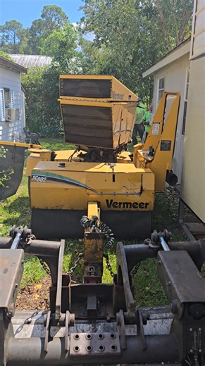 That's right our stump grinder is controlled by RC. Just for tight places like this. | Sterling tree service Inc