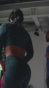 Free stock video - Vertical video of male and female athletes in fitness clothing training in gym changing rooms before or after exercise class 1