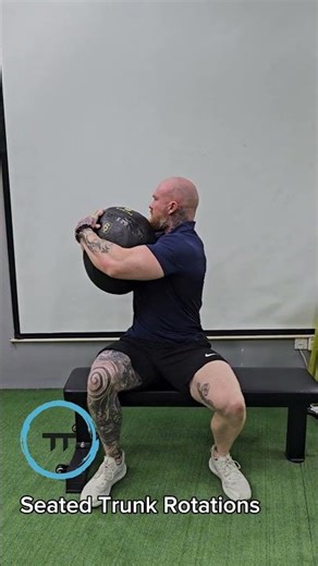 Seated trunk rotations Holding medicine ball