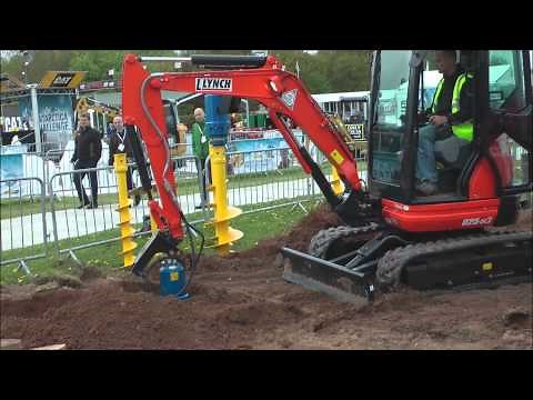 Mini excavator working with auger