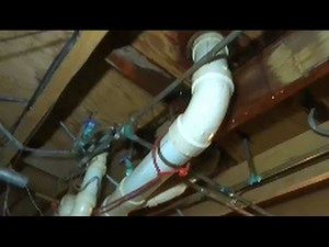 water leaking down through floor when toilet is flushed