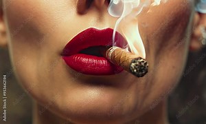 Girl with red lips smoking a cigar.