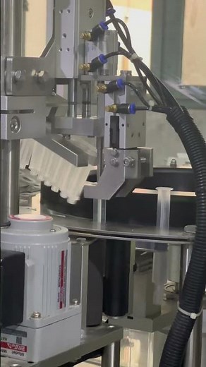 Prefilled syringe filling and closing machine. Plunger rod inserting and labeling machine.