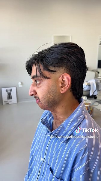 Serving middle part vibes with a modern mullet twist 🔥 #Haircut #ModernMullet #MiddlePart #FadeGoals #FreshCut