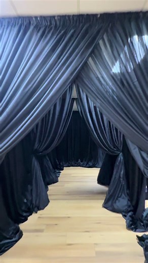 Transform Your Event with Dramatic Draped Tunnel Entrance