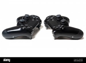 Pair of two video game controllers closeup white background Stock Photo - Alamy