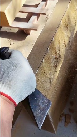 The process of chiseling sandstone into bricks