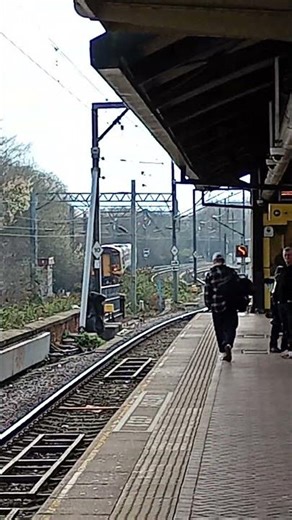Double Class 158 passing Cornbrook