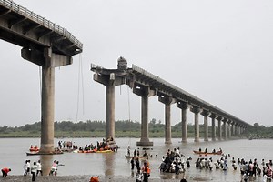 Cars plunge into river killing 9 people as section of 40-year-old bridge collapses in India